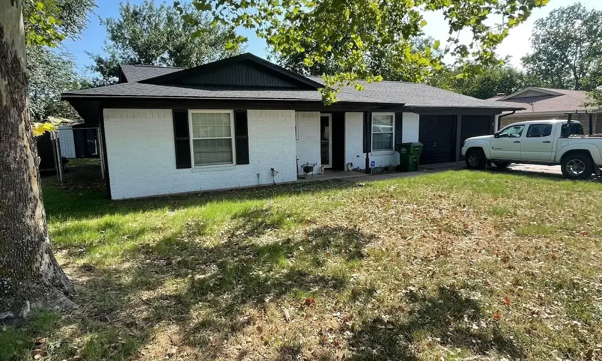 Professional roofing crew working on a residential roof in Duncan